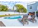 Inviting kidney-shaped pool with lounge chairs and outdoor bar at 3811 Bayside Cir, Bradenton, FL 34210