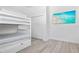 Bedroom with twin-over-twin bunk bed and large closet at 3811 Bayside Cir, Bradenton, FL 34210