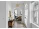 Elegant hallway with a view into the dining area and access to the exterior at 3811 Bayside Cir, Bradenton, FL 34210