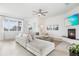 Spacious living room featuring a large sectional sofa and fireplace at 3811 Bayside Cir, Bradenton, FL 34210