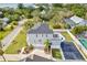 Aerial view showcasing a house's rear, pool, and basketball court at 3811 Bayside Cir, Bradenton, FL 34210