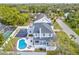 Stunning aerial view showcasing a home with a pool and basketball court at 3811 Bayside Cir, Bradenton, FL 34210