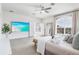 Main bedroom with large windows, a king-size bed and ocean view at 3811 Bayside Cir, Bradenton, FL 34210