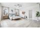 Spacious main bedroom with light flooring, large windows and a comfy bed at 3811 Bayside Cir, Bradenton, FL 34210