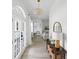 Bright hallway with an open floor plan, showing views of the living and dining areas at 3811 Bayside Cir, Bradenton, FL 34210