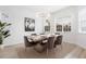 Modern dining room with large chandelier and window at 3811 Bayside Cir, Bradenton, FL 34210