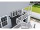 Private deck with rocking chairs and white railings, offering backyard access at 3811 Bayside Cir, Bradenton, FL 34210