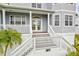 Elegant house entrance with white columns and stairs at 3811 Bayside Cir, Bradenton, FL 34210
