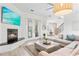 Living area features a sectional sofa, fireplace and access to balcony at 3811 Bayside Cir, Bradenton, FL 34210