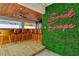 Outdoor bar with wooden barstools and green wall at 3811 Bayside Cir, Bradenton, FL 34210