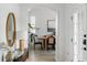 Light and airy hallway leading to the dining room, featuring a stylish console table at 3811 Bayside Cir, Bradenton, FL 34210