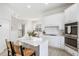 Modern kitchen with white cabinets and stainless steel appliances at 3811 Bayside Cir, Bradenton, FL 34210