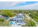 Two-story house, pool, and basketball court, aerial view at 3811 Bayside Cir, Bradenton, FL 34210