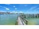 Private wooden dock extending into the water at 464 Golden Gate Pt # 504, Sarasota, FL 34236