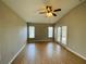 Bright living room featuring wood-look floors and sliding glass doors at 1822 Raven Glen Dr, Ruskin, FL 33570