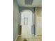 View down a hallway with archways and tiled flooring at 1822 Raven Glen Dr, Ruskin, FL 33570