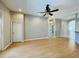 Spacious living room featuring hardwood floors and ceiling fan at 1822 Raven Glen Dr, Ruskin, FL 33570