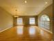 Formal dining room with hardwood floors and a chandelier at 1822 Raven Glen Dr, Ruskin, FL 33570
