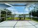 Spacious screened lanai overlooking a tranquil lake at 1822 Raven Glen Dr, Ruskin, FL 33570
