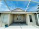 Covered patio with double French doors leading to the backyard at 1822 Raven Glen Dr, Ruskin, FL 33570