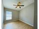 Bedroom with hardwood floors, ceiling fan and window with blinds at 1822 Raven Glen Dr, Ruskin, FL 33570