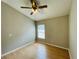 Spacious bedroom with wood-look floors and ceiling fan at 1822 Raven Glen Dr, Ruskin, FL 33570