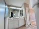 Double vanity bathroom with marble countertop and a walk-in shower at 1822 Raven Glen Dr, Ruskin, FL 33570