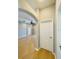 Hallway with wood floors and access to other rooms at 1822 Raven Glen Dr, Ruskin, FL 33570