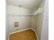 Walk-in closet with wire shelving and wood flooring at 1822 Raven Glen Dr, Ruskin, FL 33570