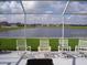 Relaxing screened lanai with lake view and comfortable seating at 1822 Raven Glen Dr, Ruskin, FL 33570