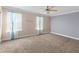 Spacious bedroom with light carpeting and ceiling fan at 2824 Esmeralda Dr, Sarasota, FL 34243