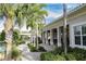 Community pool area with covered patio and lush landscaping at 2824 Esmeralda Dr, Sarasota, FL 34243