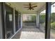 Screened porch with paver floor and ceiling fan at 2824 Esmeralda Dr, Sarasota, FL 34243