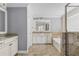 Bathroom with granite vanity, soaking tub and walk-in shower at 2824 Esmeralda Dr, Sarasota, FL 34243