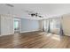 Spacious living room featuring hardwood floors and large windows at 2824 Esmeralda Dr, Sarasota, FL 34243