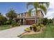 Two-story house with a brick facade and palm trees at 2824 Esmeralda Dr, Sarasota, FL 34243