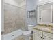 Bathroom with shower, toilet and granite countertop at 2824 Esmeralda Dr, Sarasota, FL 34243