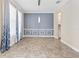 Formal dining room with tile floors and modern chandelier at 2824 Esmeralda Dr, Sarasota, FL 34243