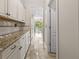 Kitchen features granite countertops and view into backyard at 2824 Esmeralda Dr, Sarasota, FL 34243