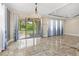 Elegant dining room with chandelier and access to the patio at 2824 Esmeralda Dr, Sarasota, FL 34243