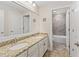 Double vanity bathroom with granite countertops and a tub at 2824 Esmeralda Dr, Sarasota, FL 34243
