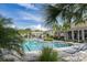 Community pool with lounge chairs and covered patio at 2824 Esmeralda Dr, Sarasota, FL 34243