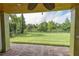 Covered patio overlooking the backyard and lake at 2824 Esmeralda Dr, Sarasota, FL 34243