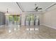 Bright living room with tile floors and large windows at 2824 Esmeralda Dr, Sarasota, FL 34243