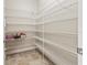 Walk-in pantry with ample shelving for storage at 2824 Esmeralda Dr, Sarasota, FL 34243