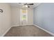 Cozy bedroom with neutral carpet and ceiling fan at 2824 Esmeralda Dr, Sarasota, FL 34243