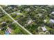 An aerial view of a home with a large backyard and surrounding trees at 3005 Desoto Rd, Sarasota, FL 34234