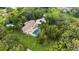 An aerial view of a house with a pool and lush landscaping at 3005 Desoto Rd, Sarasota, FL 34234