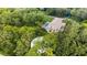 Aerial view of a house with pool, surrounded by lush greenery at 3005 Desoto Rd, Sarasota, FL 34234