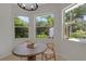 Charming kitchen nook with a round table and garden views at 3005 Desoto Rd, Sarasota, FL 34234